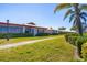 Charming single-story homes with well-maintained lawns and mature landscaping under a bright blue sky at 6420 13Th Avenue W Dr, Bradenton, FL 34209
