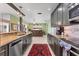 Spacious kitchen features granite counters, stainless appliances, and a bar area for entertaining at 6420 13Th Avenue W Dr, Bradenton, FL 34209