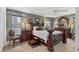 Luxurious main bedroom with dark wood furnishings and elegant decor at 6420 13Th Avenue W Dr, Bradenton, FL 34209