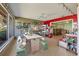 Wide view of the sunroom with water views, with an adjacent bar area at 6420 13Th Avenue W Dr, Bradenton, FL 34209