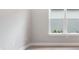 Bright bedroom featuring a large window and neutral paint to bring the outside indoors at 8024 Moonbeam Ave, Sarasota, FL 34241