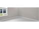 Bedroom features a large window and neutral paint to bring the outside indoors at 8024 Moonbeam Ave, Sarasota, FL 34241