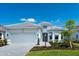 Charming single-story home with a two-car garage, well manicured landscaping, and a neatly paved walkway at 8024 Moonbeam Ave, Sarasota, FL 34241