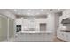 Bright kitchen featuring an island, stainless steel appliances, and ample cabinet space at 8024 Moonbeam Ave, Sarasota, FL 34241