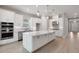 Spacious kitchen with a large island, stainless steel appliances, and modern cabinetry at 8024 Moonbeam Ave, Sarasota, FL 34241