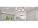 Spacious living area with open floor plan connecting the kitchen and sliding doors to the backyard at 8024 Moonbeam Ave, Sarasota, FL 34241