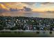 Amazing beach community with residential homes, ocean, and sunset views in an aerial shot at 915 N Shore Dr, Anna Maria, FL 34216