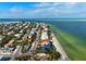 A prime aerial view of the stunning waterfront location of this coastal community at 915 N Shore Dr, Anna Maria, FL 34216