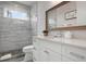Elegant bathroom with a glass-enclosed shower, floating shelves, and modern design at 915 N Shore Dr, Anna Maria, FL 34216