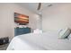 Cozy bedroom featuring a TV, dresser, and a comfortable king bed at 915 N Shore Dr, Anna Maria, FL 34216