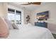 Bedroom featuring a plush king bed, a dresser with a TV, and balcony access at 915 N Shore Dr, Anna Maria, FL 34216