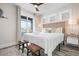 Bedroom with stylish decor featuring a king bed, balcony access, and decorative furniture at 915 N Shore Dr, Anna Maria, FL 34216