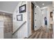 Hallway featuring decorative beach themed accents and an elevator at 915 N Shore Dr, Anna Maria, FL 34216