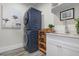 Laundry room featuring stacked washer and dryer and a utility sink at 915 N Shore Dr, Anna Maria, FL 34216