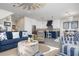 Spacious living room with kitchen view, modern decor, and comfortable seating at 915 N Shore Dr, Anna Maria, FL 34216