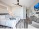 Bright bedroom with a mounted television and serene decor creates a relaxing atmosphere at 915 N Shore Dr, Anna Maria, FL 34216