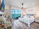 Beautiful bedroom with ocean views from the balcony, providing a serene and luxurious escape at 915 N Shore Dr, Anna Maria, FL 34216