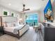 Relaxing main bedroom with a balcony overlooking the ocean, offering stunning views and a peaceful retreat at 915 N Shore Dr, Anna Maria, FL 34216