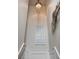 A whimsically decorated stairwell showcases a unique chandelier and artistic decor at 915 N Shore Dr, Anna Maria, FL 34216