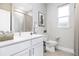 Bathroom with a white vanity, brushed nickel faucet and a shower/tub combination at 1342 Shaker Ln, North Port, FL 34286
