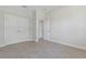 Bedroom featuring tile floors, a closet and an open doorway at 1342 Shaker Ln, North Port, FL 34286