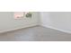 Empty bedroom with tile floors and a large window at 1342 Shaker Ln, North Port, FL 34286