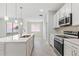 Well-lit kitchen featuring modern appliances and an open layout, perfect for entertaining at 1342 Shaker Ln, North Port, FL 34286