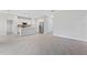 Modern kitchen featuring white cabinetry, stainless appliances, and breakfast bar seating at 1342 Shaker Ln, North Port, FL 34286