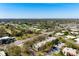 Beautiful aerial view of community condos surrounded by lush landscaping and a clear blue sky at 3201 Beneva Rd # 204, Sarasota, FL 34232