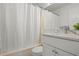 Clean bathroom featuring a tub with shower, vanity, and neutral color palette at 3201 Beneva Rd # 204, Sarasota, FL 34232