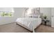Bright bedroom featuring a comfortable bed, stylish lighting, and a serene view at 3201 Beneva Rd # 204, Sarasota, FL 34232