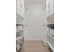 Walk-in closet with built-in shelves for optimal storage at 3201 Beneva Rd # 204, Sarasota, FL 34232