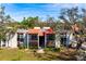 Charming condo exterior with red tile roof, balconies, and lush landscaping at 3201 Beneva Rd # 204, Sarasota, FL 34232