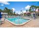 Enjoy this beautiful community pool and lounge area with ample seating and lush landscaping at 3201 Beneva Rd # 204, Sarasota, FL 34232