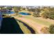Scenic aerial view of a well-maintained golf course with lush greenery and serene water features at 4570 Pinebrook Cir # 303, Bradenton, FL 34209