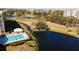 Aerial view of the community pool and tranquil pond at 4570 Pinebrook Cir # 303, Bradenton, FL 34209