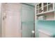 Bathroom features a glass shower and built in shelving with towels at 4570 Pinebrook Cir # 303, Bradenton, FL 34209