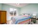 Bright bedroom with a comfortable bed, large window, and closet, creating a cozy and inviting space at 4570 Pinebrook Cir # 303, Bradenton, FL 34209