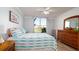 Bright bedroom with a large window overlooking pond at 4570 Pinebrook Cir # 303, Bradenton, FL 34209