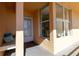 Inviting entrance featuring a bench with pillows, a white door, and a large window showcasing the interior at 4570 Pinebrook Cir # 303, Bradenton, FL 34209