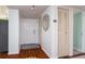 Well-lit hallway featuring a decorative mirror and convenient closet space, enhancing the home's interior at 4570 Pinebrook Cir # 303, Bradenton, FL 34209