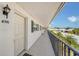 Exterior hallway view of a condo unit with a neutral color scheme and access to community amenities at 4741 Independence Dr, Bradenton, FL 34210