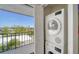 Functional laundry room with stacked washer and dryer, and sliding doors to a balcony at 4741 Independence Dr, Bradenton, FL 34210