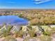 Aerial view showcasing the house with waterfront view at 4914 Lakescene Pl, Sarasota, FL 34243