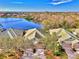 Aerial view of the house showcasing the backyard and beautiful lake at 4914 Lakescene Pl, Sarasota, FL 34243