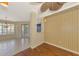 Open dining room includes hardwood floors, a modern ceiling fan, and seamless access to outdoor living at 4914 Lakescene Pl, Sarasota, FL 34243