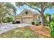 Charming exterior of home showing garage, landscaping, and stone details at 4914 Lakescene Pl, Sarasota, FL 34243