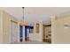 Bright living room featuring tile floors, crown molding, and an open floor plan at 4914 Lakescene Pl, Sarasota, FL 34243