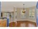 Spacious living area showcasing hardwood floors and an open floor plan with many windows at 4914 Lakescene Pl, Sarasota, FL 34243