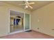 Outdoor patio with brick flooring that leads to an open living area through sliding glass doors at 4914 Lakescene Pl, Sarasota, FL 34243